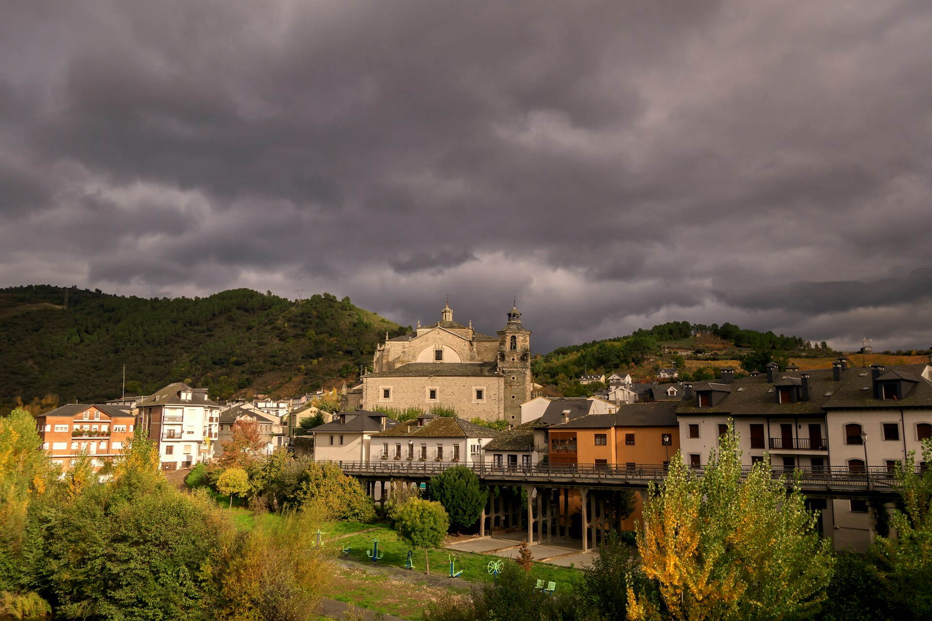 a group of buildings with trees in the back